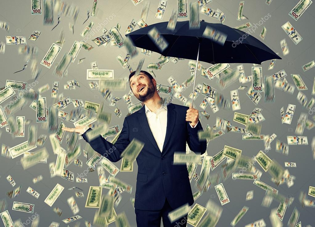 depositphotos_49286917-stock-photo-man-standing-under-money-rain.jpg