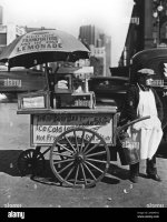 1930s-new-york-city-hot-dog-stand-west-st-and-north-moore-vendor-stands-next-to-his-tellas-bus...jpg