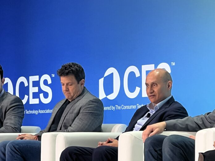 Qualcomm's Durga Malladi, right, talks edge AI during CES 2025.