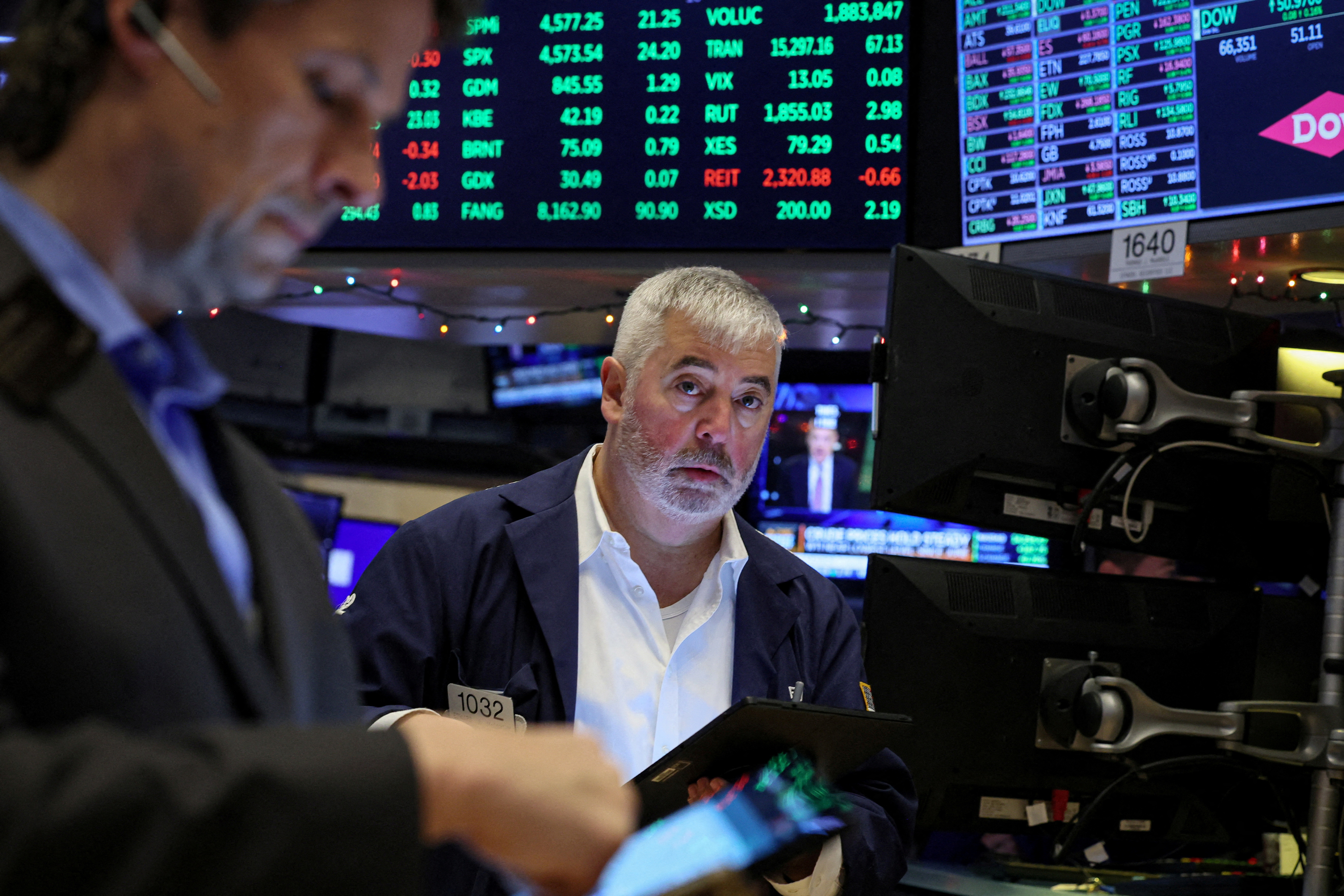 Traders work on the floor of the NYSE in New York