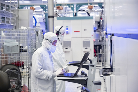 A photo from November 2021 shows employees in clean room bunny suits working at Intel's D1X factory in Hillsboro, Oregon. A D1X fab expansion due for completion in 2022 will help meet a sharply increasing global demand for semiconductors. (Credit: Intel Corporation)