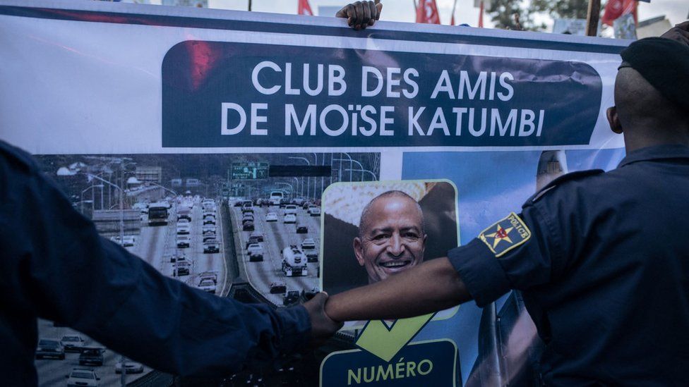 A poster of the Friends of Moise Katumbi, one of the main opponents of President Felix Tshisekedi, is held during Katumbi's election rally in a stadium in Goma, one of the largest cities in the east of the Democratic Republic of Congo, on November 23, 2023.