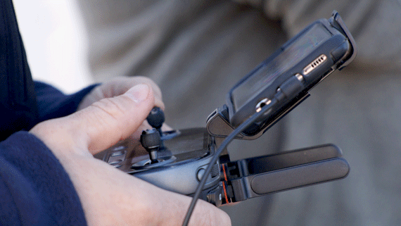 Controller being used to test and fly a drone.