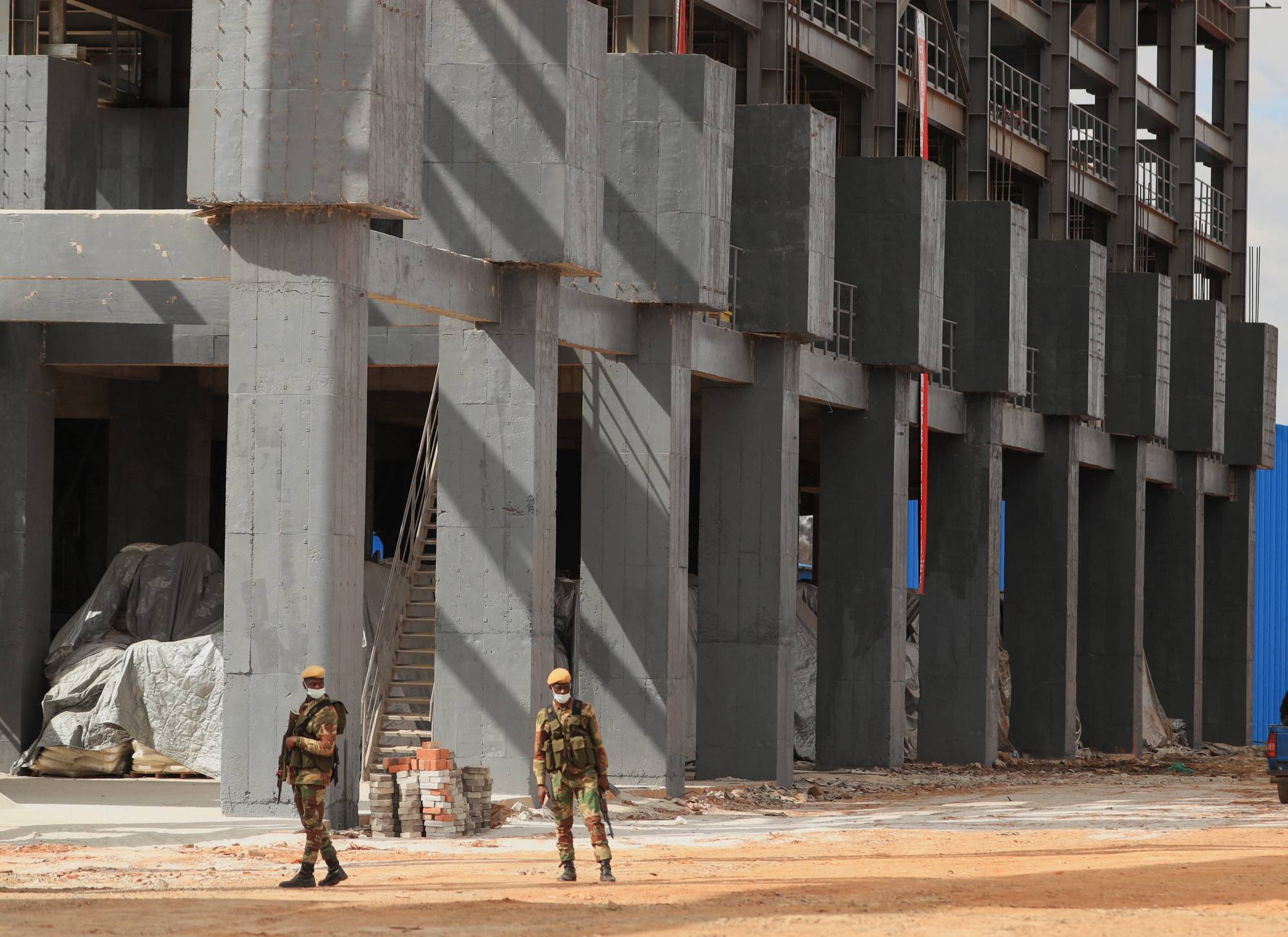 Armed soldiers stand guard as Zimbabwe’s President Emmerson Mnangagwa commissions the Prospect Lithium mine and processing plant in Goromonzi, Zimbabwe, on July 5. | REUTERS