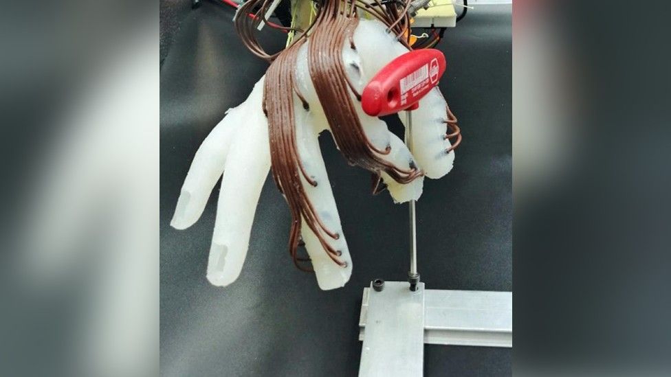 Robotic hand holding an object