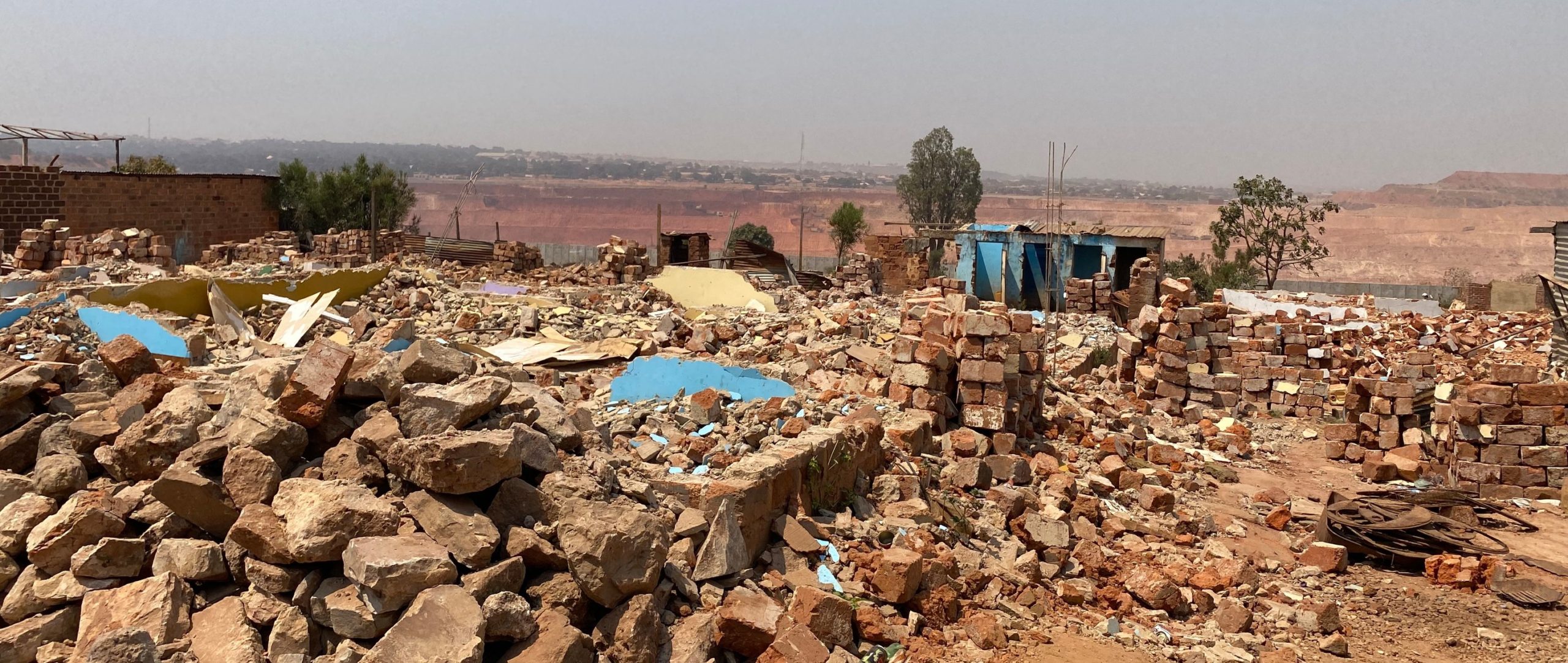 Piles of rubble from demolished houses.