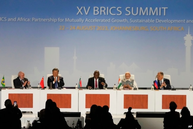 FILE - China's Xi Jinping, 2nd left, is among the leaders attending the BRICS summit in Johannesburg, Aug. 24, 2023.